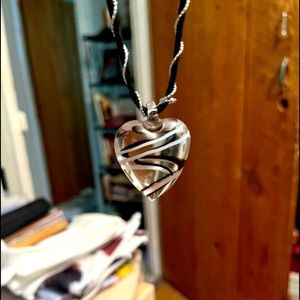 Never worn necklaces one has a glass heart the other is a gold chain